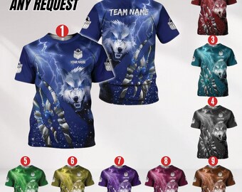 May include: A collection of short-sleeved t-shirts with a wolf design and lightning graphics. The shirts are available in various colors, including blue, red, green, and purple. The text "CUSTOM ANY REQUEST" and "YOUR NAME" are visible on the shirts.