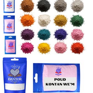 May include: An assortment of colorful powders and packaged products. The powders are in various shades, including brown, black, gray, orange, white, yellow, green, purple, teal, blue, pink, and red. Several packages display the "DANTOR" logo and the text "POUD KONTAN WE'M".
