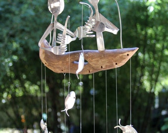 Pair Of Flatware Men Fishing On Top Of A Driftwood Dingy, Seven Silver Plated Fish Swim Beneath-Gone Fishing Spoon Fish Wind chime.