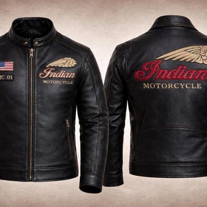 May include: Black leather motorcycle jacket with "Indian Motorcycle" embroidered on the front and back. Features a stand-up collar, zipper closure, and American flag patches. The jacket has gold and red embroidery.
