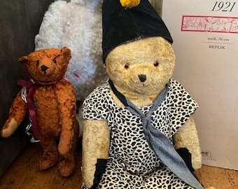 large antique bear with clown hat