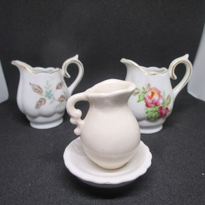 3 tiny Porcelain Pitchers