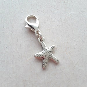 Dije de plata tibetana con forma de estrella de mar, cierre de langosta, marcador de puntada y cremallera.