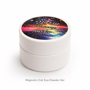 May include: A white, round container with a lid featuring a colorful galaxy design and the text "Starry Starry Nails." The product is labeled "Magnetic Cat Eye Powder Gel."