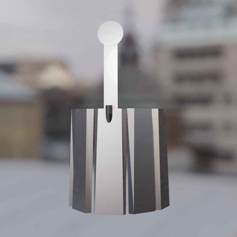 May include: A contemporary bottle stopper with a silver finish. It has a rectangular base with angled vertical panels and a long, thin stem, finished with a circular disc at the top.