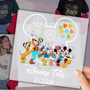 May include: A graphic featuring Disney characters Pluto, Goofy, Donald Duck, Daisy Duck, Minnie Mouse, and Mickey Mouse. The design includes fireworks, Mickey Mouse-shaped balloons, and the text "Disney Trip 2026" on a white background.