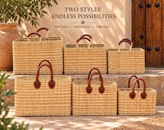 May include: Six rectangular woven straw baskets in varying sizes, each featuring two brown leather handles attached with stitched leather patches. The text "TWO STYLES ENDLESS POSSIBILITIES" and "NATURAL • HANDMADE • TIMELESS" is visible above the baskets.