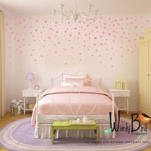 May include: A bedroom scene with a white bed, pink bedding, and a green bench. Pink star decals adorn the white walls. A round purple rug sits on the wooden floor. A chandelier hangs from the ceiling. The room has a soft, inviting atmosphere.