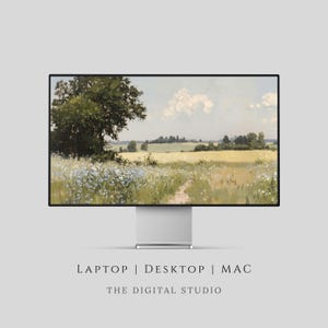 May include: A computer monitor displays a pastoral landscape painting. The artwork features a path through a field of wildflowers and tall grass, with trees and a cloudy sky in the background. The monitor is on a silver stand, with the text "LAPTOP | DESKTOP | MAC" and "THE DIGITAL STUDIO" below.