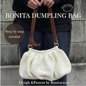 May include: Cream-coloured Bonita Dumpling Bag with brown straps and gold-coloured rings. The bag is crocheted and has a gathered design. Text on the image reads "Bonita Dumpling Bag", "Step by step tutorial", and "Design & Pattern by Bonitayarns."