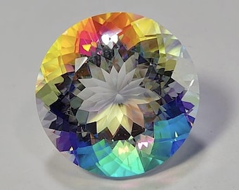 May include: A round, faceted gemstone featuring a vibrant iridescent finish. The surface displays a spectrum of colors including yellow, orange, pink, purple, and blue, with a central star-like pattern created by the precise geometric cuts.