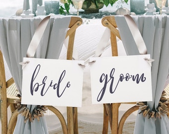 Elegante bruid en bruidegom stoelborden, heer en mevrouw spandoeken, bewegwijzering voor bruiloftsreceptie