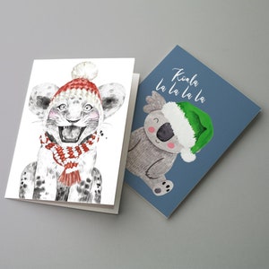 Pacote com 24 cartões de Natal divertidos em 12 designs coloridos + envelopes para crianças e adultos RR2 6931