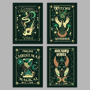 May include: Four dark green art prints with mystical illustrations. Each print features a different design with text: "Cosmic Christmas Vibes," "Witchy Wishes," "I hope your Christmas is Magical," and "Holiday Vibes." The designs include moons, stars, hands, and other celestial elements.