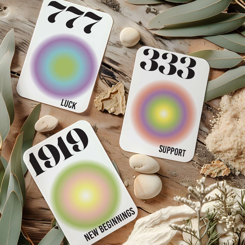 May include: Three cards with colorful gradient circles and numbers 777, 333, and 1919. The cards also have the words "Luck", "Support", and "New Beginnings" printed on them.