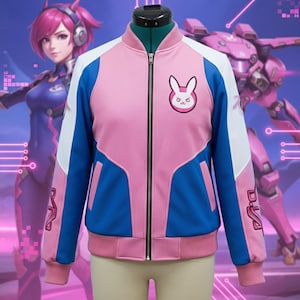 May include: Pink, blue, and white zip-up jacket with a bunny logo on the chest. The jacket has blue sleeves and accents, white shoulder panels, and pink ribbed cuffs and hem. The jacket is displayed on a mannequin.