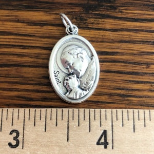 Pope John Paul II on back of Divine Mercy Medal