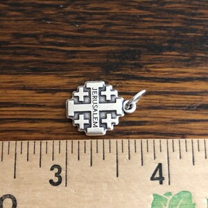 Jerusalem Cross Crusader Charm next to ruler for size