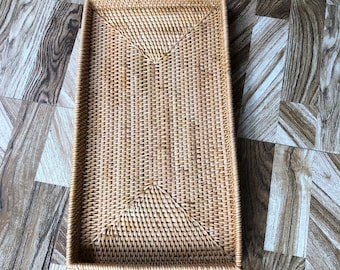 The tray is made of woven bamboo and Rattan