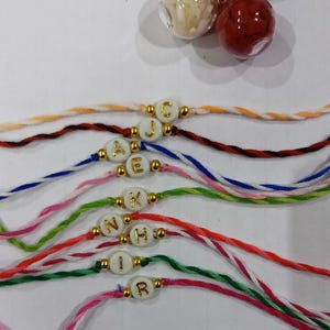 Personalized Initial Rakhi for Brother – Handmade Thread Bracelet with Custom Alphabet Bead | Raksha Bandhan Gift | Name Rakhi