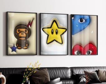 May include: Three framed wall art pieces. The first features a brown monkey-like character with a red lightning bolt and a blue star. The second is a yellow star with black eyes. The third has a blue eye and a red heart with eyes.