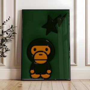 Pode incluir: Uma obra de arte verde emoldurada com um personagem de macaco estilizado com traços faciais laranja e um contorno preto. Um gráfico de estrela preta está acima do macaco. A obra de arte está em um fundo verde brilhante.