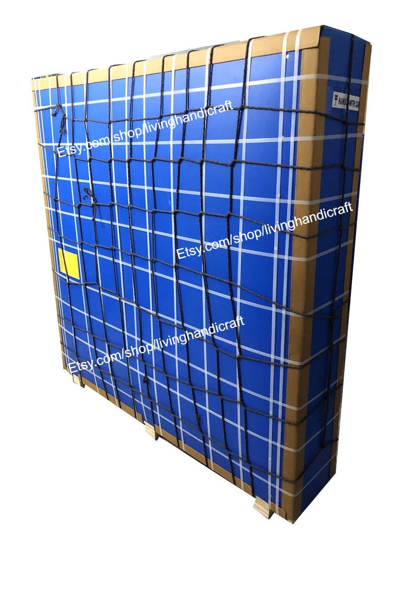 May include: A large, rectangular package wrapped in blue and brown cardboard. The package is secured with a black net and white tape. The text "Etsy.com/shop/livinghandicraft" is visible on the package.
