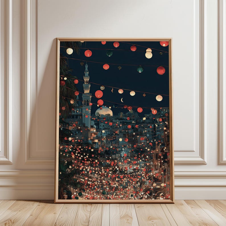 Festive night cityscape illustration featuring strings of red, green, and white lantern lights hanging over a busy Middle Eastern street with a mosque dome and minaret in the background. The digital wall art uses deep navy, warm yellow, and soft red tones to create a cozy, celebratory mood perfect for Ramadan, Eid, or cultural home decor.