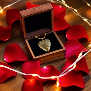 Handmade Indian jewelry: Moonstone heart pendant featuring a detailed tree of life wire wrap.