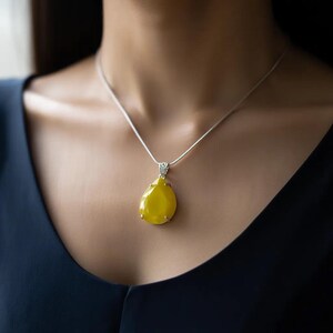 Handmade Indian jewelry: Yellow opal trillion pendant featuring a detailed, faceted cut.