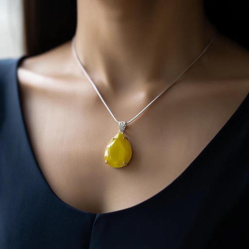 Handmade Indian jewelry: Yellow opal trillion pendant featuring a detailed, faceted cut.