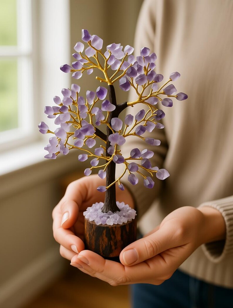 Side view of crystal amethyst tree on wood stand for abundance and chakra healing.
