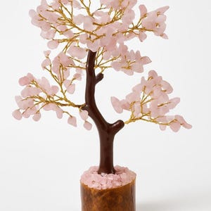 Love & healing décor: rose quartz tree of life for office accent.
