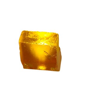 Natural raw yellow sapphire rough gemstone isolated on white background
