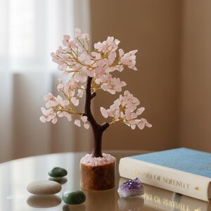Side view of heart chakra wish tree of life sculpture on resin base.