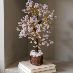 Spiritual home décor: amethyst tree of life on wooden base.