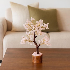 Pink crystal tree of life for positive energy and protection in home décor.