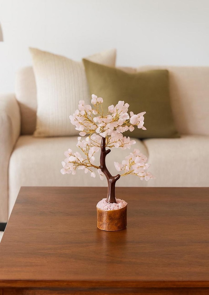 Pink crystal tree of life for positive energy and protection in home décor.
