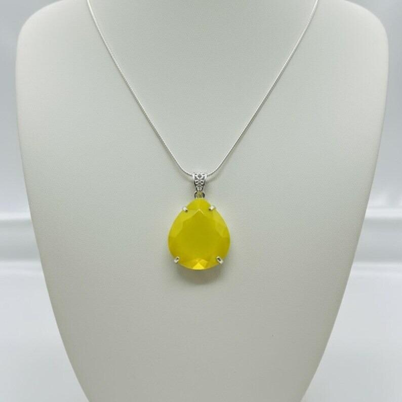 Artisan yellow opal trillion pendant, highlighting the natural stone and silver details.