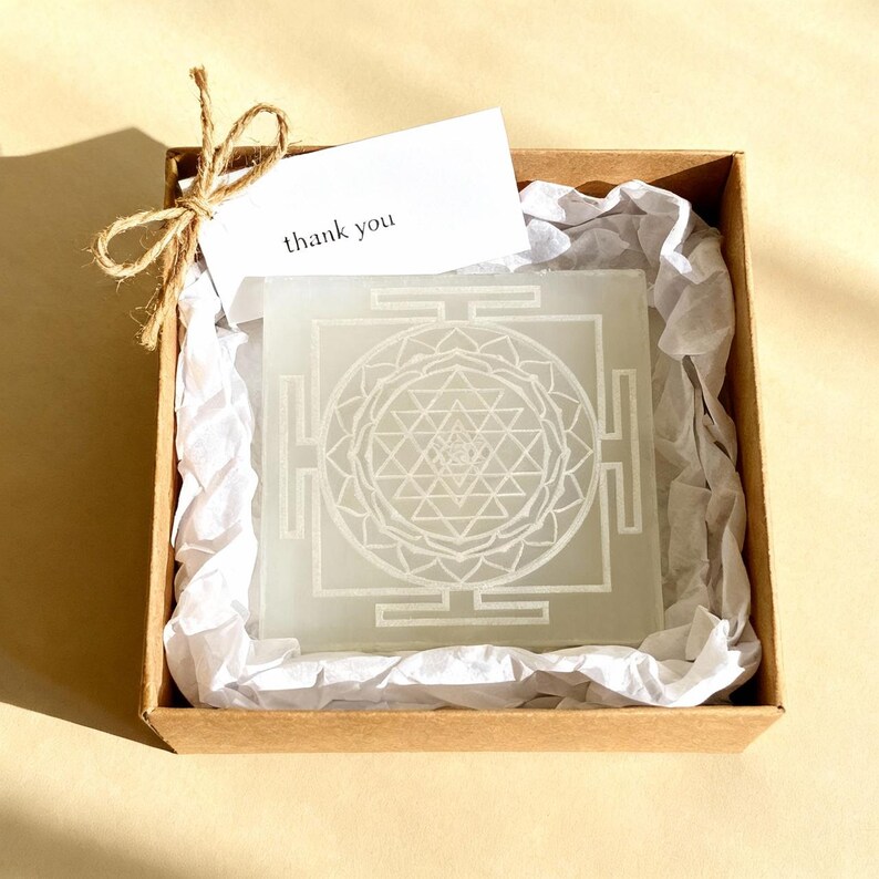 "Selenite plate with Shri Yantra design, perfect for energy cleansing and meditation."
