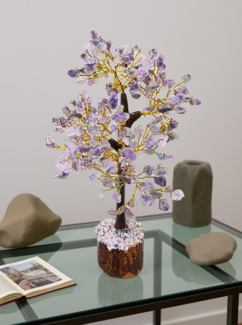 Handmade amethyst chip gem tree on natural wood base for peace and intuition.