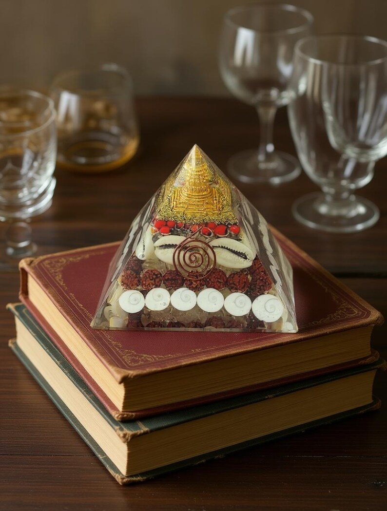 “spiritual healing pyramid with shells, beads, copper coil and quartz”