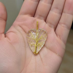 Spiritual healing jewelry: Moonstone heart pendant with a tree of life motif, perfect for intuition and spiritual growth.