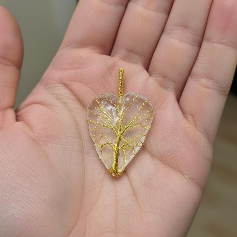 Spiritual healing jewelry: Moonstone heart pendant with a tree of life motif, perfect for intuition and spiritual growth.