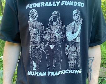 Fed Funded Human Trafficking - Screenprinted Political Cotton T-shirt