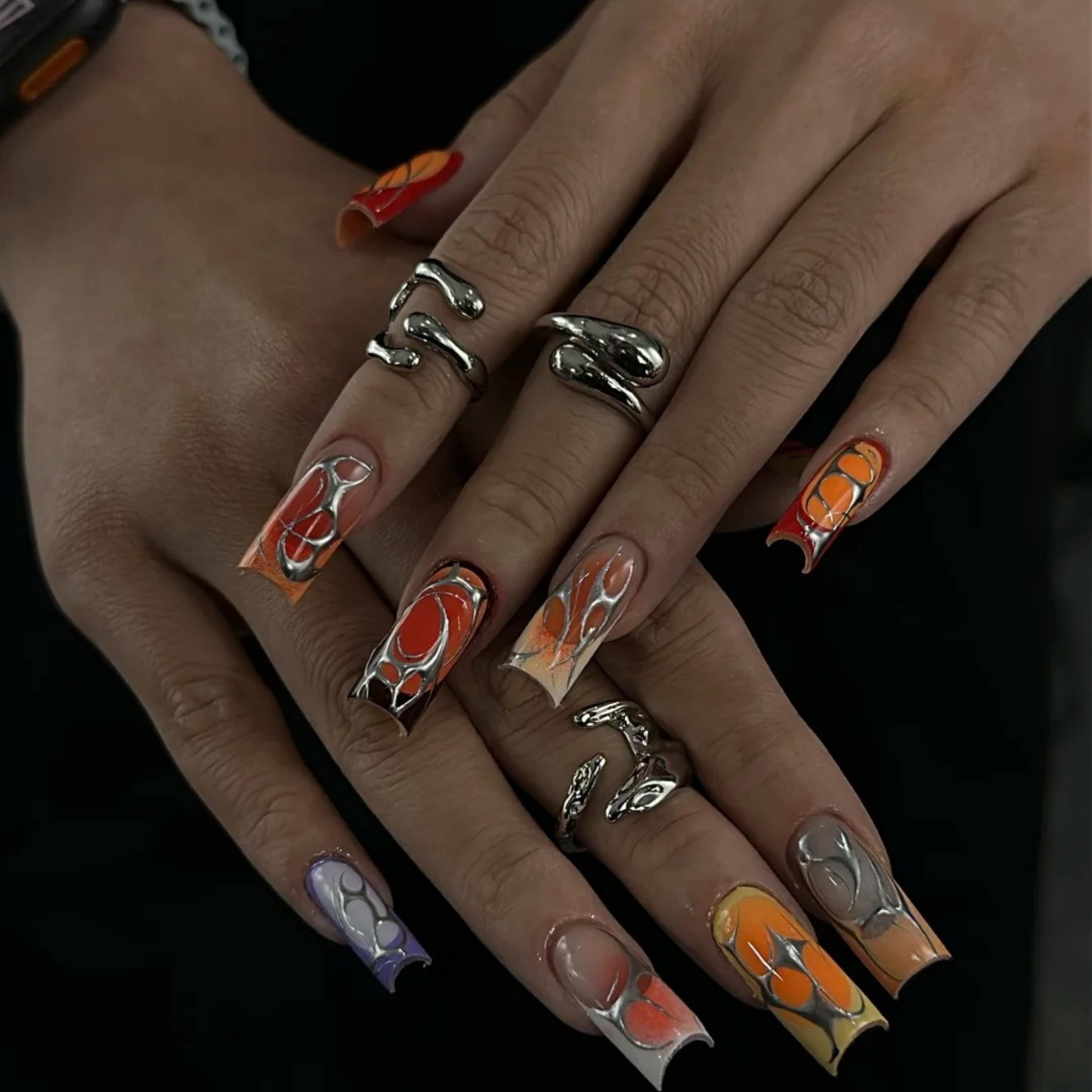 Luminous Red Swirl Nail Design