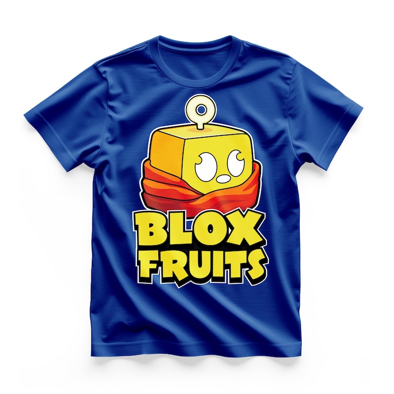 May include: A royal blue t-shirt featuring a cartoon character with a yellow square head, white eyes, and a red scarf. The text "BLOX FRUITS" is in yellow with a black outline.