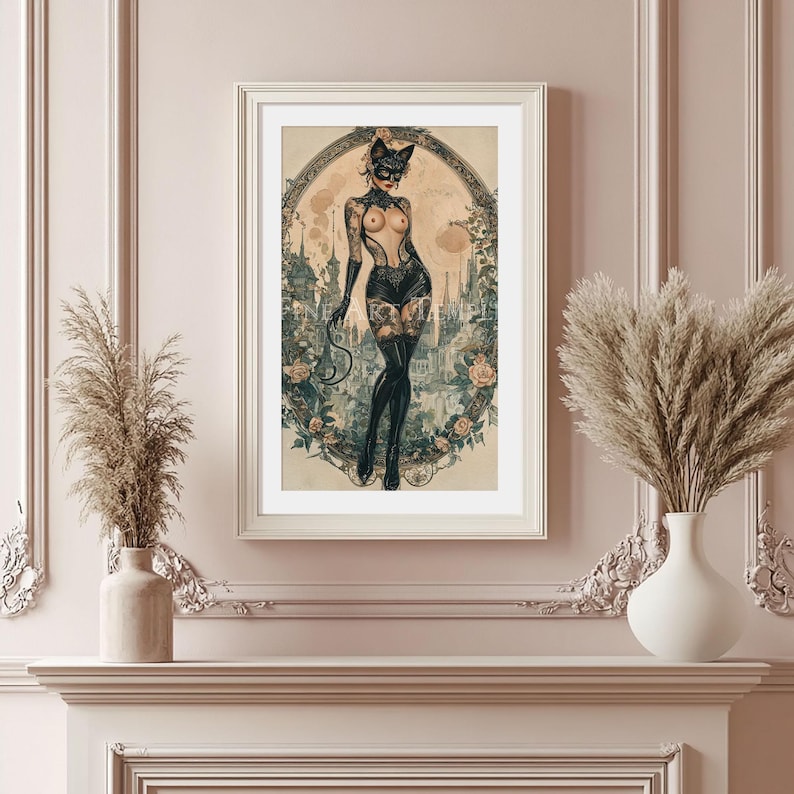 May include: Framed art print featuring a vintage-style illustration of a woman in a cat mask and lingerie, with tattoos. The artwork is set against a backdrop of a city and floral elements, framed in a white border.