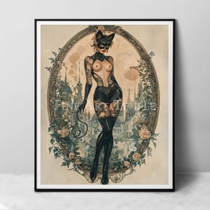 May include: A framed print featuring a woman in a cat mask and black lingerie, set against a vintage-style background with a castle and floral border. The print has the text "FINE ART TEMPLE".