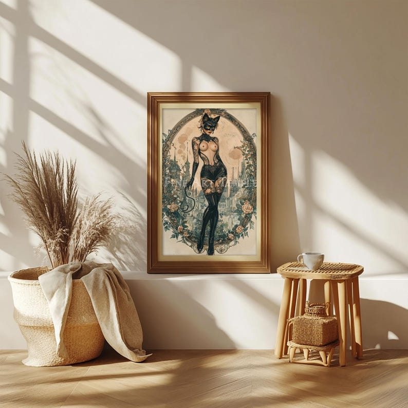 May include: A framed art print featuring a vintage-style illustration of a woman in a cat costume. The artwork is set against a backdrop of a cityscape and floral elements, with a gold-colored frame.